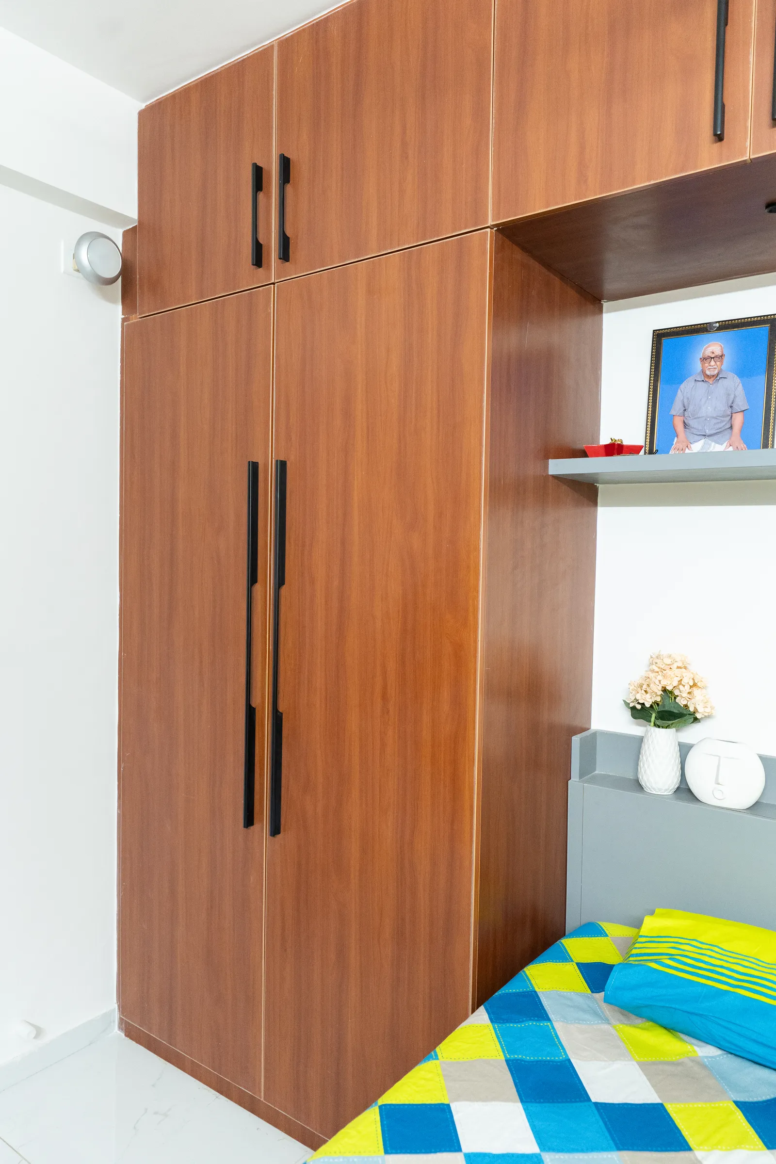 Teak wardrobe with built-in display niche — Karthik's Residence